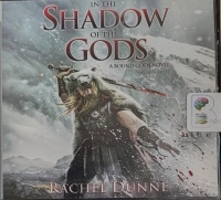 In The Shadow of the Gods - A Bound Gods Novel Book 1 written by Rachel Dunne performed by Alex Wyndham on Audio CD (Unabridged)